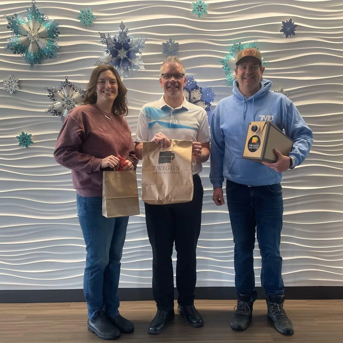 Three supporters holding NoahStrong gift bags