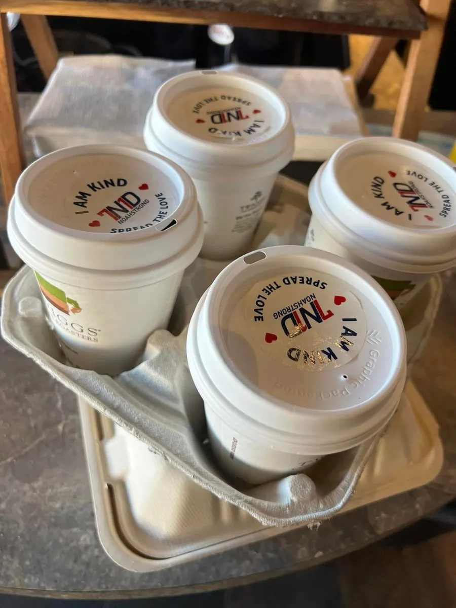 Coffee cups with I am kind NoahStrong lids