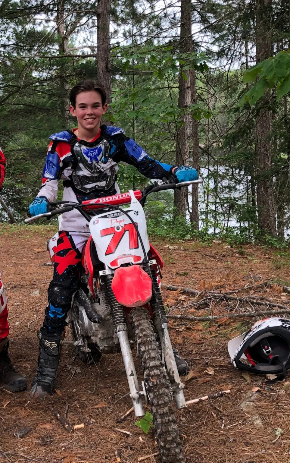 Noah Dugas sitting on his dirt bike