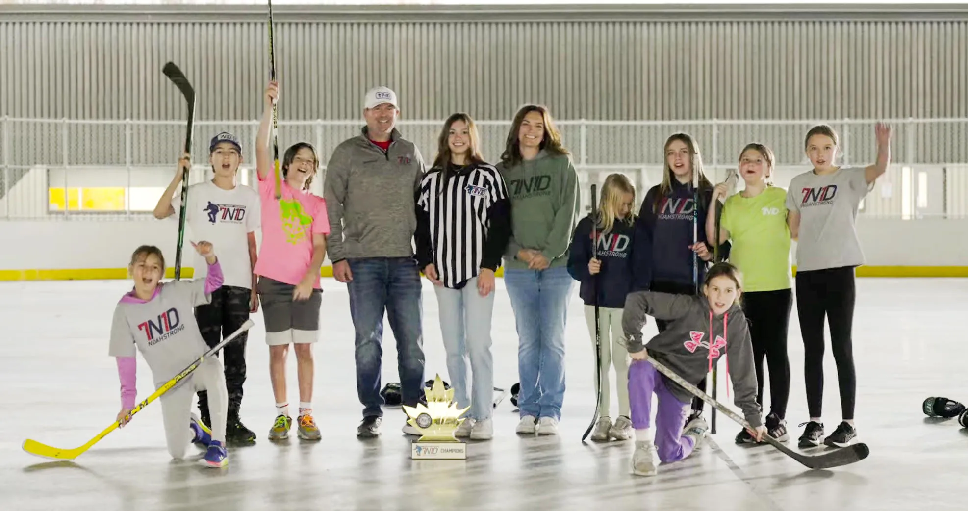 The Dugas family receiving the Logan Boulet Award